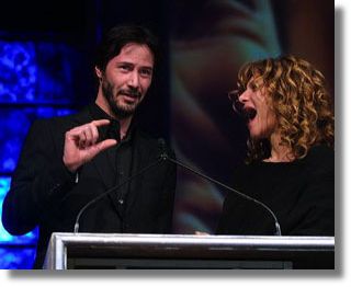 Keanu and Amy Pascal, chairman of Sony's Columbia Pictures at ShoWest 2004 - Photo by Ryan Miller